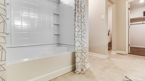 Primary bathroom with walk-in closet.
