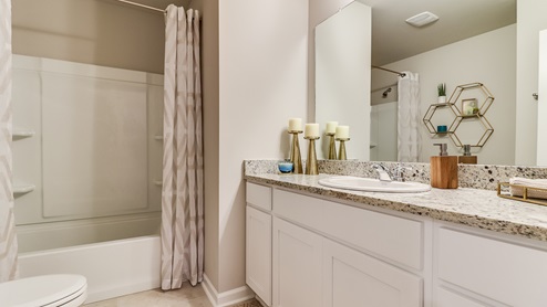 Guest bathroom located near guest bedrooms
