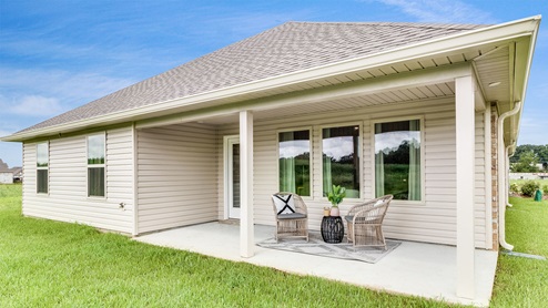 Covered patio with fully sodded yeard