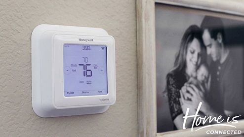 Air condition thermostat wall panel with digital display that is controlled by smart technology.