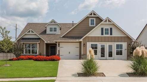 Modern farmhouse exterior with beige siding